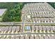 New community with lush trees, showcasing pools and community buildings from above at 123 Meridian Dr, Woodstock, GA 30188