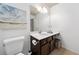 Well-lit bathroom with a vanity, drawers, large mirror and neutral colors at 123 Meridian Dr, Woodstock, GA 30188