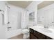 Cozy bathroom featuring a shower-tub combo and a wood vanity with a sink at 123 Meridian Dr, Woodstock, GA 30188