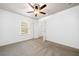 Bedroom featuring neutral carpet, closet with an open door, and ceiling fan at 123 Meridian Dr, Woodstock, GA 30188