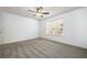 Bedroom with a ceiling fan, neutral carpet, large window, and white walls at 123 Meridian Dr, Woodstock, GA 30188
