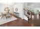 Bright dining room featuring hardwood floors, wainscoting, and modern chandelier at 123 Meridian Dr, Woodstock, GA 30188