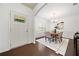 Bright dining room featuring hardwood floors, elegant chandelier, and wainscoting detail at 123 Meridian Dr, Woodstock, GA 30188