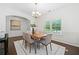 Dining area featuring hardwood floors, wainscoting, and neutral decor, ready for entertaining at 123 Meridian Dr, Woodstock, GA 30188