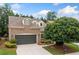 Charming brick home with a well-manicured lawn and a two-car garage at 123 Meridian Dr, Woodstock, GA 30188