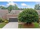 Charming brick home with a well-manicured lawn and a two-car garage at 123 Meridian Dr, Woodstock, GA 30188