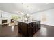 Open-concept kitchen island featuring granite countertops and stainless steel appliances at 123 Meridian Dr, Woodstock, GA 30188