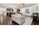 Open-concept living area showcasing the kitchen, living room furniture, and fireplace at 123 Meridian Dr, Woodstock, GA 30188