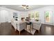 Inviting living room with hardwood floors, neutral décor, and ample natural light at 123 Meridian Dr, Woodstock, GA 30188