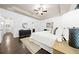 Stylish main bedroom featuring wood floors, tray ceilings and ensuite bathroom at 123 Meridian Dr, Woodstock, GA 30188