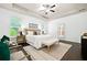 Inviting main bedroom featuring wood flooring, tray ceilings and lots of natural light at 123 Meridian Dr, Woodstock, GA 30188