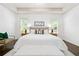 Lovely bedroom offers tray ceilings, wood floors and lots of natural light at 123 Meridian Dr, Woodstock, GA 30188