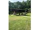Large park pavilion offers seating and shelter, perfect for gatherings amidst scenic surroundings and natural beauty at 123 Meridian Dr, Woodstock, GA 30188