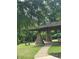 Charming park pavilion is complete with stone supports and picnic seating, inviting visitors to relax and enjoy the scenery at 123 Meridian Dr, Woodstock, GA 30188