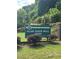 City of Woodstock's Olde Rope Mill Park sign invites visitors to explore the beautiful natural surroundings at 123 Meridian Dr, Woodstock, GA 30188