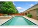 Refreshing backyard pool with a stone surround and lush landscaping at 123 Meridian Dr, Woodstock, GA 30188