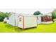 View of the manufactured home showing the lawn, and handy storage shed at 263 Gulfport Ct, Hampton, GA 30228