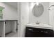 Well-lit bathroom with a white sink vanity, modern fixtures, and marble countertops at 4212 Burns Heritage Ne Trl, Roswell, GA 30075