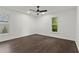 Bright bedroom featuring hardwood floors, fan, recessed lighting, and large windows at 4212 Burns Heritage Ne Trl, Roswell, GA 30075