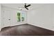 Minimalist bedroom with hardwood floors, large windows, and plenty of natural light creates a relaxing space at 4212 Burns Heritage Ne Trl, Roswell, GA 30075