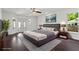 Bedroom with hardwood floors and plenty of natural light through large windows at 4212 Burns Heritage Ne Trl, Roswell, GA 30075
