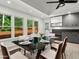 Open dining room filled with sunlight, modern table setting, and backyard views at 4212 Burns Heritage Ne Trl, Roswell, GA 30075