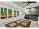 Bright kitchen with gray cabinets, a built-in desk, and a view of the backyard at 4212 Burns Heritage Ne Trl, Roswell, GA 30075
