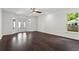 Spacious living room featuring hardwood floors, ample natural light, and neutral walls at 4212 Burns Heritage Ne Trl, Roswell, GA 30075