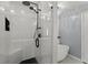 Bright, updated shower with bench seating and dual shower heads for a luxurious bathing experience at 4212 Burns Heritage Ne Trl, Roswell, GA 30075