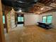 Spacious basement featuring a climbing wall, pool table, and natural light from multiple windows at 1915 Habersham Trce, Cumming, GA 30041
