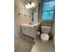 Bathroom with a single sink vanity and a toilet at 1915 Habersham Trce, Cumming, GA 30041