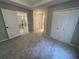 Spacious bedroom features neutral walls, carpet flooring, and a closet, offering a serene retreat at 1915 Habersham Trce, Cumming, GA 30041