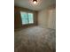 Cozy bedroom featuring a double door closet and a large window with a peaceful view at 1915 Habersham Trce, Cumming, GA 30041
