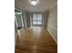 Bright dining area with hardwood floors and a large window offering ample natural light at 1915 Habersham Trce, Cumming, GA 30041