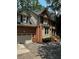 Brick home with an attached garage and a well-manicured landscape, offering a welcoming curb appeal at 1915 Habersham Trce, Cumming, GA 30041