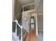 Two-story foyer with hardwood floors, neutral paint, and stairs with iron railings at 1915 Habersham Trce, Cumming, GA 30041