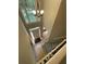 Two-story foyer with hardwood floors, neutral paint, and stairs with iron railings at 1915 Habersham Trce, Cumming, GA 30041