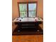 Bright game room featuring an air hockey table positioned in front of a sunny window at 1915 Habersham Trce, Cumming, GA 30041