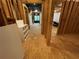 Unfinished basement hallway reveals spaces for climbing wall, and pool table with natural light at 1915 Habersham Trce, Cumming, GA 30041