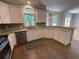 Spacious kitchen with ample counter space, stainless steel appliances, and tiled floor at 1915 Habersham Trce, Cumming, GA 30041