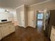 Open-concept kitchen featuring tiled floors, seamless flow to living spaces, and stainless steel appliances at 1915 Habersham Trce, Cumming, GA 30041