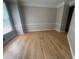 Spacious living room featuring light hardwood floors and bright, natural light at 1915 Habersham Trce, Cumming, GA 30041