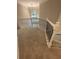 Elegant staircase with wrought iron spindles and plush carpeting, bathed in natural light at 1915 Habersham Trce, Cumming, GA 30041