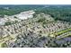 Aerial view of a large residential community featuring a lake, pool, and surrounding commercial area at 2013 White Cypress Ct, Smyrna, GA 30082