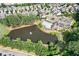 Community pond and pool surrounded by neatly arranged homes and lush greenery at 2013 White Cypress Ct, Smyrna, GA 30082