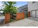 Backyard view featuring wooden fence and gate, planting beds, small shed and view of the patio at 2013 White Cypress Ct, Smyrna, GA 30082