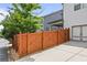 Backyard view featuring wooden fence and gate, planting beds and view of the patio at 2013 White Cypress Ct, Smyrna, GA 30082