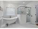 Luxurious bathroom featuring a freestanding tub, glass-enclosed shower, and modern finishes at 2013 White Cypress Ct, Smyrna, GA 30082