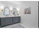 Elegant bathroom boasts a double vanity, marble countertops, and stylish brass fixtures and lighting at 2013 White Cypress Ct, Smyrna, GA 30082