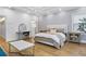 Charming bedroom with board and batten wall, tray ceiling, and adjacent bathroom with glass shower at 2013 White Cypress Ct, Smyrna, GA 30082